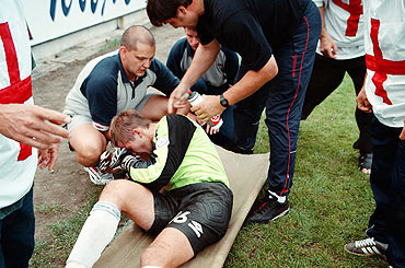 Serhiy Perkhun is tended to by medics after his clash with an opponent