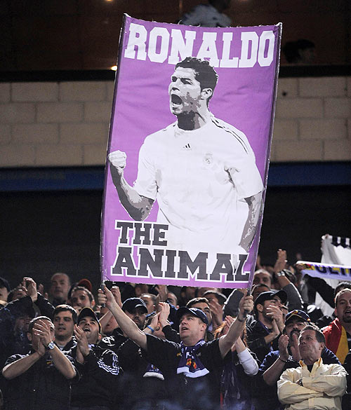 A Real Madrid fan holds up a banner of Cristiano Ronaldo