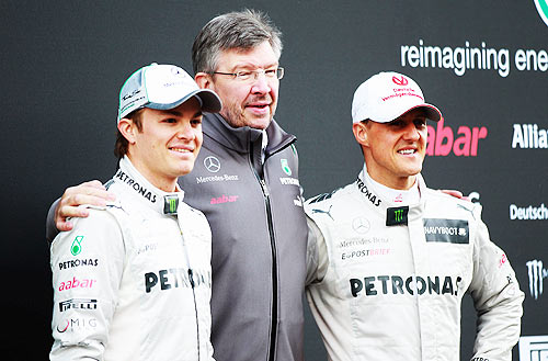 Michael Schumacher of Mercedes GP, Nico Rosberg and team principal Ross Brawn