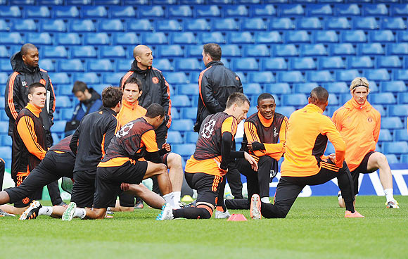 Chelsea players warm up during a training session ahead of their UEFA Champions League semi-final against Barcelona