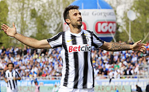 Juventus' Mirko Vucinic celebrates after scoring against Novara on Sunday
