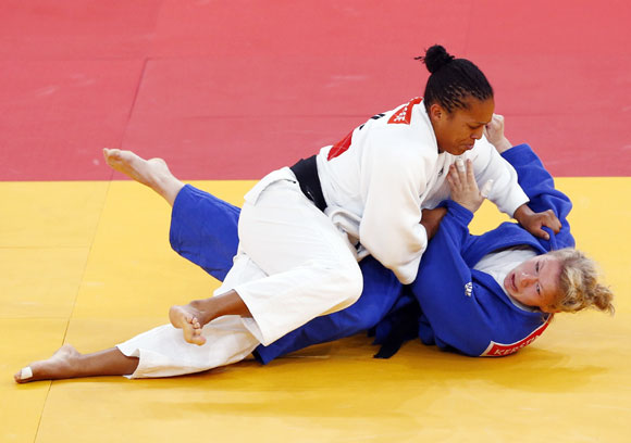 France's Lucie Decosse fights with Germany's Kerstin Thiele (blue) in their women's -70kg final judo match