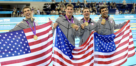 United States' Michael Phelps, Conor Dwyer, Ryan Lochte and Ricky Berens pose with their gold medals after the men's 4x200-meter freestyle relay swimming final on Tuesday