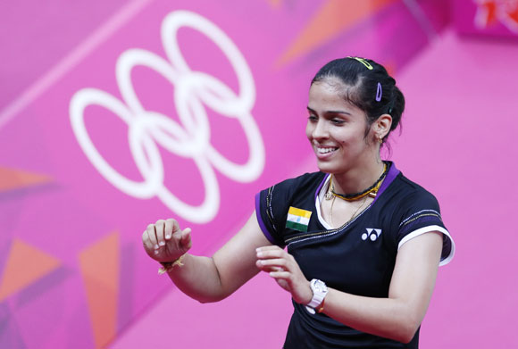 India's Saina Nehwal celebrates winning against Denmark's Tine Baun during their womens singles badminton quarterfinals match