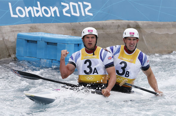 Britain's Tim Baillie (L) and Etienne Stott react to winning the men's canoe double (C2) final at Lee Valley White Water Centre during the London 2012 Olympic Games