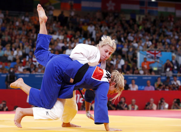 Kayla Harrison of the U.S. fights with Britain's Gemma Gibbons (blue) during their women's -78kg final judo match