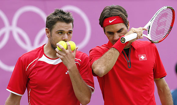 Switzerland's Roger Federer (right) and Stanislas Wawrinka during their men's doubles match against Israel's Andy Ram and Jonathan Erlich during the London 2012 Olympic Games on Wednesday