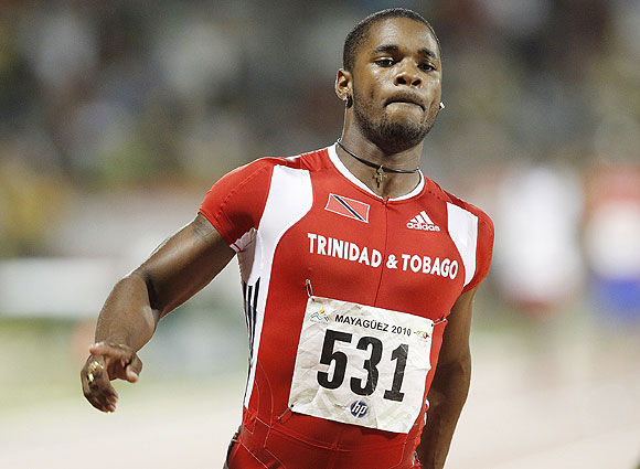 Trinidad and Tobago's Keston Bledman crosses the finish line to win the men 4x100 relay final at the Central American and Caribbean games in Mayaguez