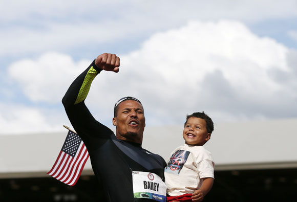 Ryan Bailey celebrates with his son Tyree after coming third in the men's 100 meter final at the U.S. Olympic athletics trials in Eugene