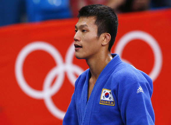 South Korea's Cho Jun-Ho reacts after losing to Japan's Masashi Ebinuma in their men's -66kg quarter-final judo match