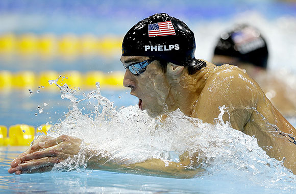 United States' Michael Phelps leads compatriot Ryan Lochte during the men's 200-meter individual medley swimming final on Thursday