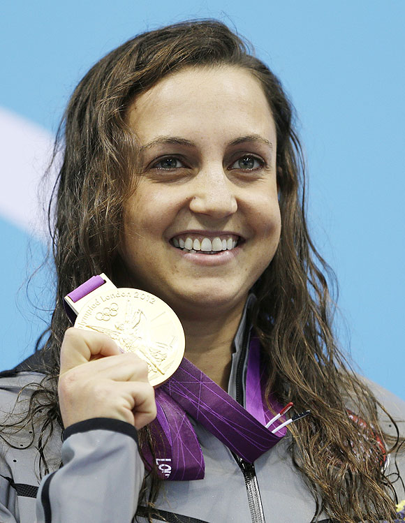 United States' Rebecca Soni poses with her gold medal for the women's 200-meter breaststroke swimming final on Thursday