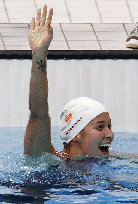Netherlands' Ranomi Kromowidjojo celebrates winning the women's 100m freestyle final with an Olympic record on Thursday