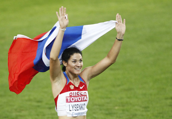 Tatyana Lysenko of Russia celebrates winning the women's hammer throw final at the IAAF World Athletics Championships in Daegu