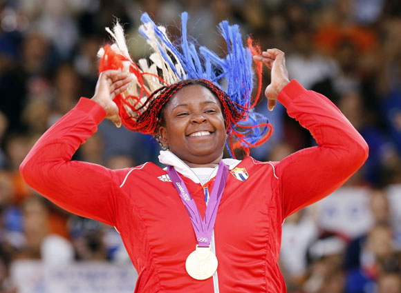 Gold medallist Cuba's Idalys Ortiz jumps at the victory ceremony for the women's +78kg judo event
