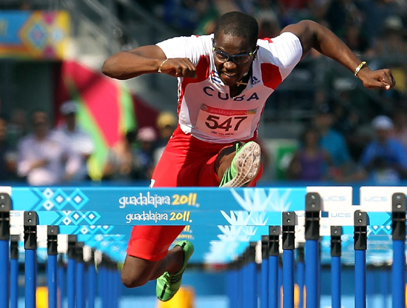 Dayron Robles of Cuba competes in the men's 110m hurdles final during Day 14 of the XVI Pan American Games