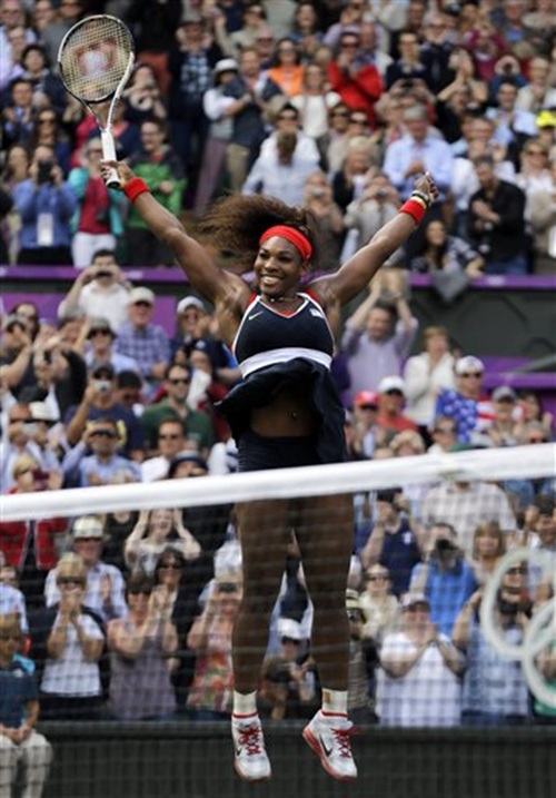 Serena Williams celebrates after defeating Maria Sharapova