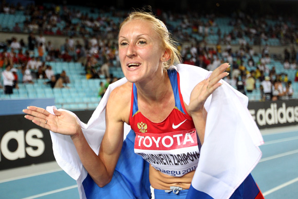 Yuliya Zaripova of Russia celebrates claiming gold in the women's 3000 metres steeplechase final during day four of the 13th IAAF World Athletics Championships at the Daegu Stadium