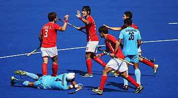 Nam Hyun Woo of South Korea celebrates with team mates after his goal