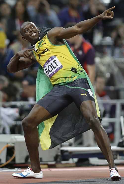 Jamaica's Usain Bolt celebrates after winning the men's 100-metre final