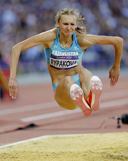 Kazakhstan's Olga Rypakova competes to win gold in the women's triple jump final