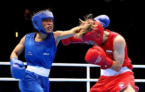 Mary Kom of India in action with Karolina Michalczuk of Poland during the Women's Fly (48-51kg) Boxing