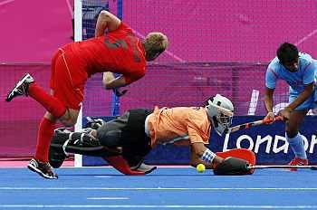 Belgium's Jerome Dekeyser scores against India