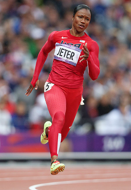 Carmelita Jeter of the United States runs in the Women's 200m heat on Monday