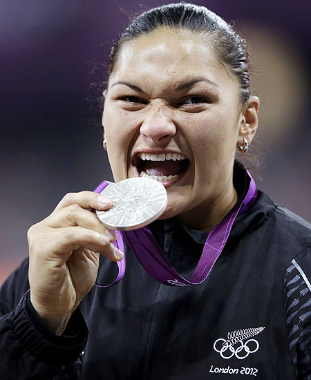 New Zealand's Valerie Adams holds her silver medal for women's shot put during the athletics in the Olympic Stadium on Monday