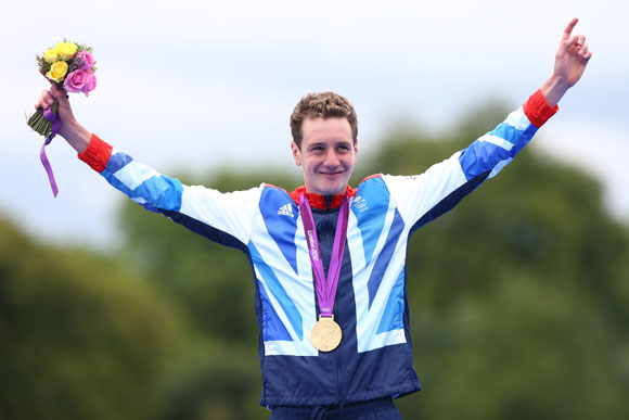 Alistair Brownlee of Great Britain celebrates with his gold medal during the medal ceremony for the Men's Triathlon