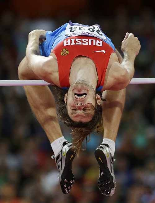 Russia's Ivan Ukhov clears the bar in the men's high jump final during the athletics in the Olympic Stadium