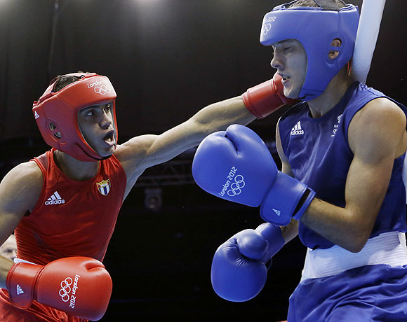 Robeisy Ramierez Carrazana of Cuba (left) and Andrew Selby of Great Britain, in action during a flyweight 52-kg quarter-final bout on Tuesday
