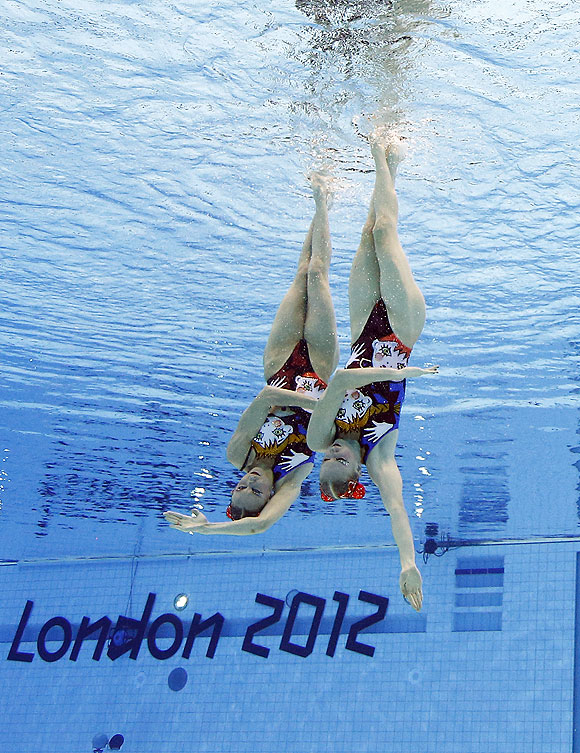 Natalia Ishchenko and Svetlana Romashina of Russia compete during women