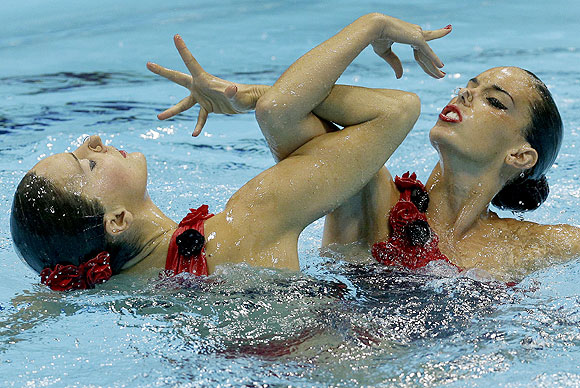 Silver medalists Ona Carbonell Ballestero and Andrea Fuentes Fache from Spain compete during the women's duet synchronized swimming final on Tuesday