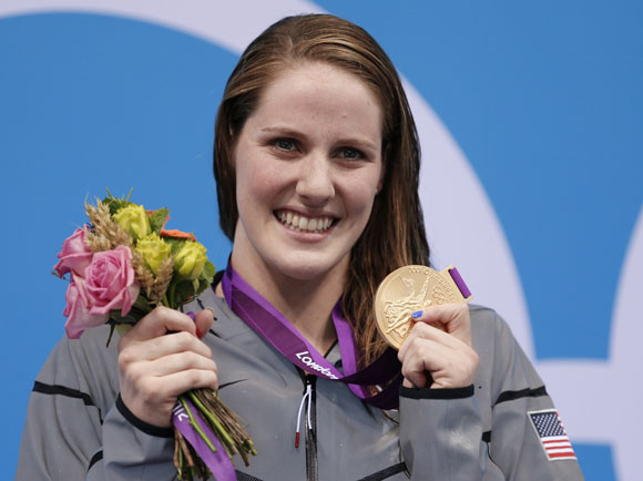 Gold medallist Missy Franklin of the U.S., who set a new world record, poses at the women's 200m backstroke victory ceremony