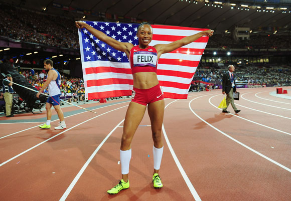 Allyson Felix of the United States celebrates after winning gold in the Women's 200m Final