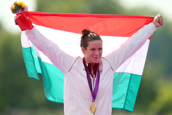 Gold medalist Eva Risztov of Hungary celebrates after winning the gold medal in the Women's Marathon 10km Swimming at Hyde Park