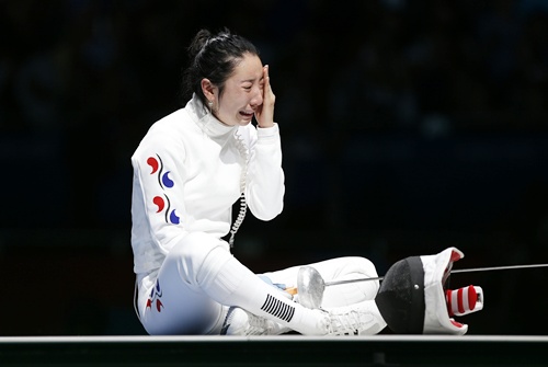 South Korea's Shin A Lam reacts after being defeated by Germany's Britta Heidemann