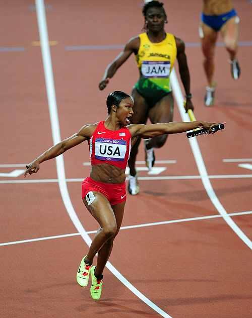 Carmelita Jeter of the United States celebrates winning gold in the Women's 4 x100m Relay Final
