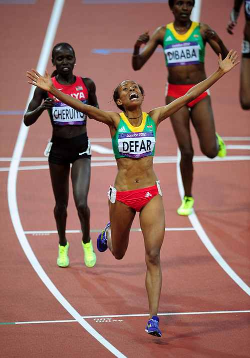 Meseret Defar of Ethiopia celebrates winning gold in the Women's 5000m Final