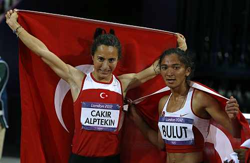 Turkey's Asli Cakir Alptekin and Gamze Bulut (R) celebrate after winning gold and silver in the women's 1500m final during the London 2012 Olympic Games
