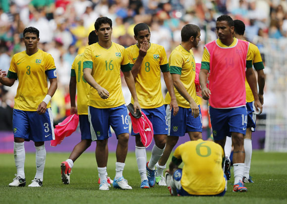Brazil's players react after losing their men's football gold medal match against Mexico at Wembley Stadium