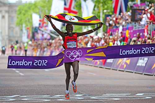 Stephen Kiprotich of Uganda celebrates as he approaches the line to win gold in the Men's Marathon