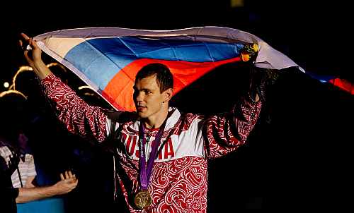 Gold medalist Egor Mekhontcev of Russia celebrates after the medal ceremony for the Men's Light Heavy (81kg) Boxing final bout