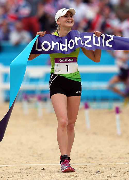 Laura Asadauskaite of Lithuania crosses the line in first place to win the Gold medal in the Women's Modern Pentathlon