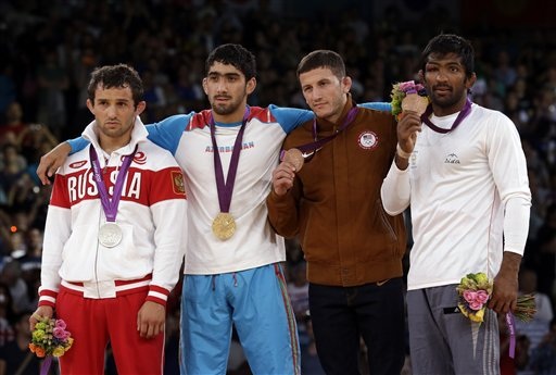 The medallists (left to right): Silver medalist Besik Kudukhov of Russia, gold medalist Toghrul Asgarov of Azerbaijan, bronze medalist Coleman Scott of the United States and Yogeshwar Dutt