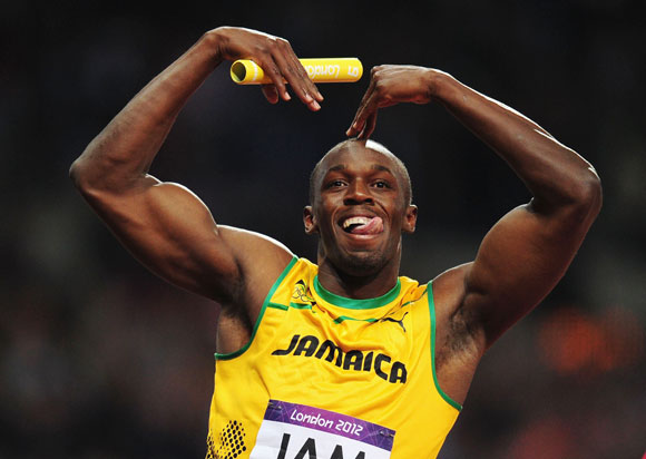 Usain Bolt of Jamaica celebrates winning gold and setting a new world record of 36.84 during the Men's 4 x 100m Relay Final