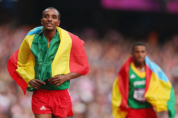 Dejen Gebremeskel of Ethiopia celebrates winning silver after the Men