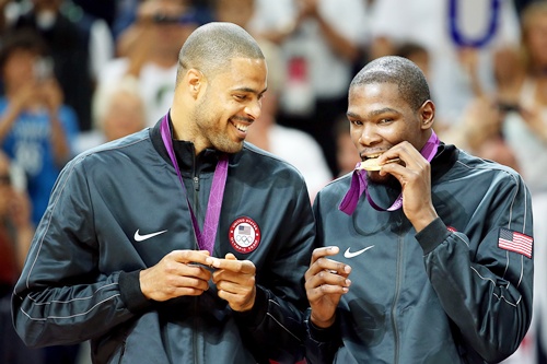Gold medallists Tyson Chandler of the United States and Kevin Durant of the United States celebrate on the podium