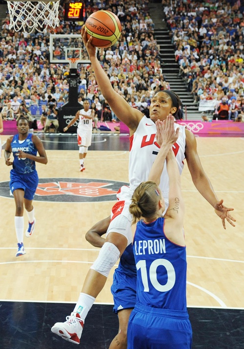 Florence Lepron of France tries to block Maya Moore of United States during the Women's Basketball Gold Medal game